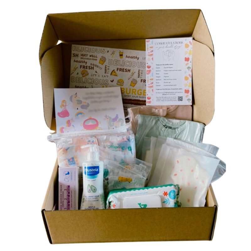 Newborn customised gift box includes diapers, bibs, wet wipes, shower gel, diaper cream, onesie, pajamas, burp cloths, and a personalised gift card.